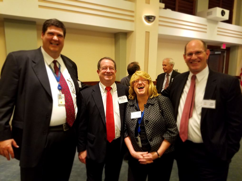 Stephen Dove, Tom Jarvis (USITC Alum), Juliana Cofrancesco (USITC), and Kent Stevens (USITC Alum) at the Centennial reception.   