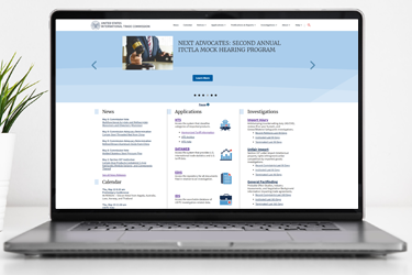 Laptop showcasing the redesigned USITC.gov homepage