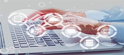 Hands typing on laptop computer keyboard